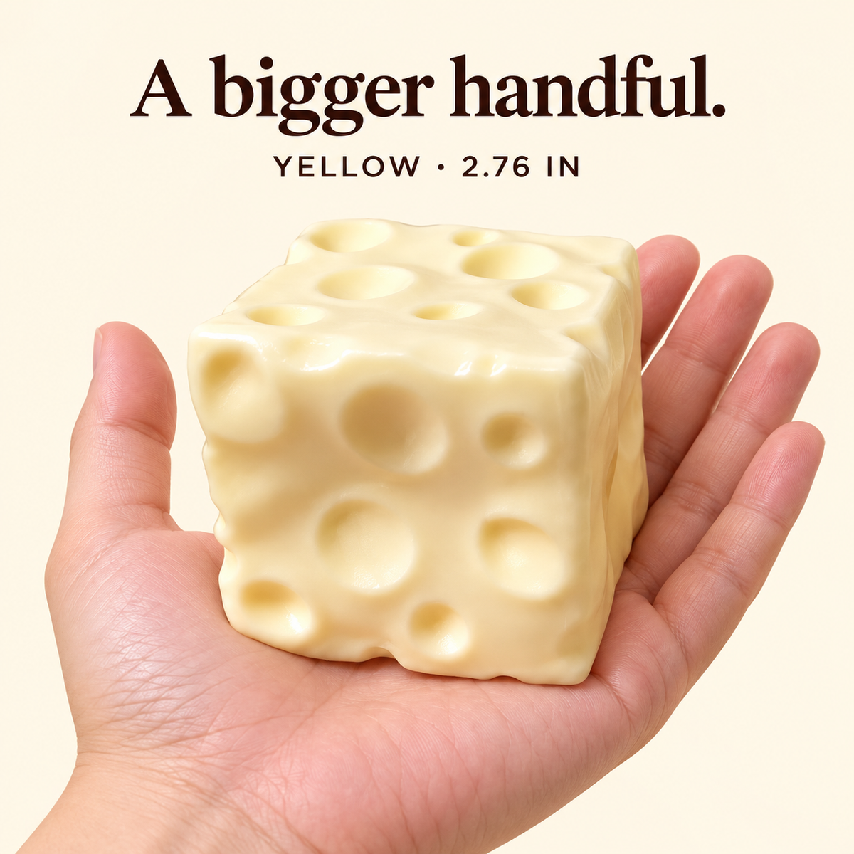Large yellow 2.76-inch cheese squishy on an adult palm