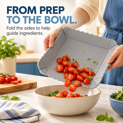 Gray folding mat guiding tomatoes into a bowl